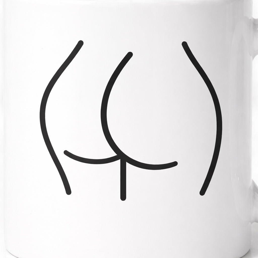 Close-up of minimalist black line art design printed on white ceramic mug