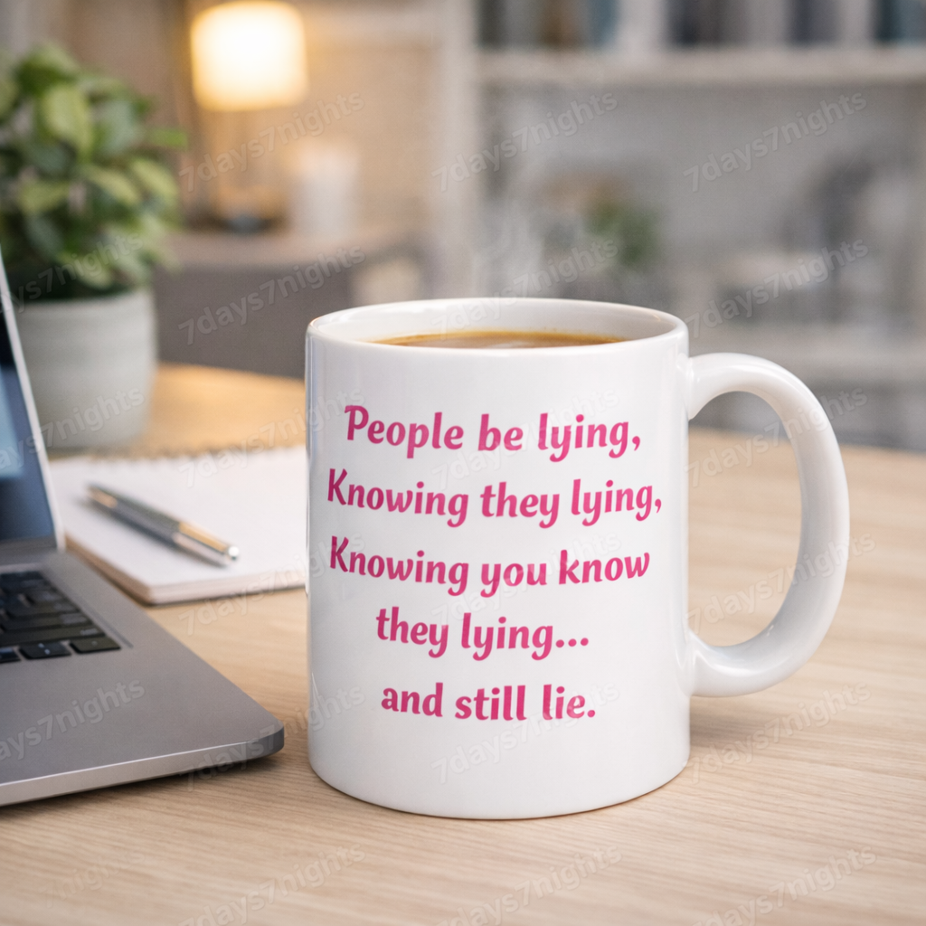 Funny quote mug on desk with laptop and coffee steam.