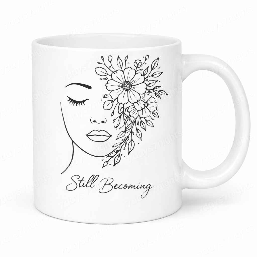 Still Becoming inspirational mug with floral line art design on white ceramic coffee cup.