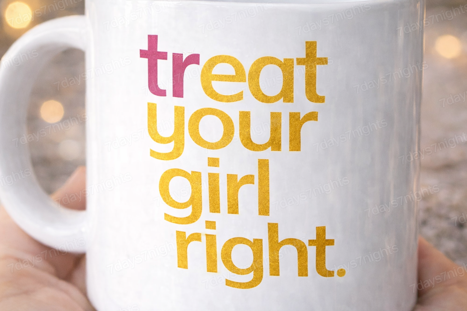 Close-up of treat your girl right text design on coffee mug.